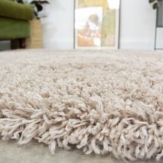 a close up view of a shaggy rug in a living room