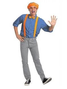 a man with an orange bow tie and suspenders is standing in front of a white background