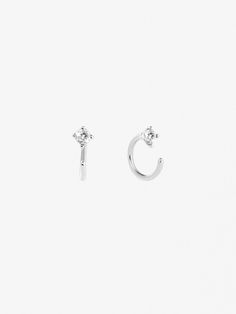 Our cubic zirconia hoop earrings are the perfect way to add subtle sparkle to your everyday look. Crafted in sterling silver, dipped in a layer of rhodium, then adorned with round cubic zirconia gemstonesthese dainty huggies effortlessly elevate every outfit. Wear these cubic zirconia hoop earrings alone or pair them with our Elise Silver earrings for a well-rounded look. Silver not your color? Try our original Cassie earrings!  Crafted in sterling silver  Dipped in rhodium  365-day warranty Minimalist Silver Diamond Hoop Earrings, Silver Diamond Minimalist Hoop Earrings, Silver Diamond Hoop Earrings Minimalist Style, Single Small Hoop Diamond Earrings In Sterling Silver, Minimalist White Gold Hoop Earrings With Cubic Zirconia, Dainty Sterling Silver Small Hoop Diamond Earrings, Dainty Small Hoop Diamond Earrings In Sterling Silver, Silver Small Hoop Diamond Earrings For Everyday, Everyday Silver Diamond Cartilage Earrings