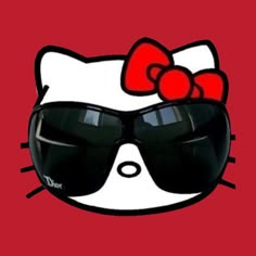 a hello kitty wearing sunglasses with a red bow on it's head and black glasses