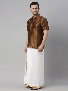 VM BY VASTRAMAY Men's Coffee Solid Ethnic Shirt And Mundu Set A stylish choice for traditional occasions, this VM BY VASTRAMAY Men's Coffee Solid Ethnic Shirt And Mundu Set combines elegance with comfort. Crafted from high-quality fabric, it offers a perfect blend of style and functionality. Features Traditional Coffee Solid Ethnic Shirt Elegant Mundu Comfortable Fit High-quality Fabric Specifications Brand: VM BY VASTRAMAY Color: Coffee Material: [Material details] Sizes Available: [Sizes] Mate Traditional Festive Short Sleeve Shirt, Traditional Short Sleeve Festive Shirt, Casual Short Sleeve Kurta For Festive Occasions, Traditional Short Sleeve Festive Kurta, Short Sleeve Traditional Wear For Eid, Traditional Fit Short Sleeve Shirt, Traditional Brown Cotton Wear, Brown Cotton Traditional Wear, Traditional Short Sleeve Tops For Eid