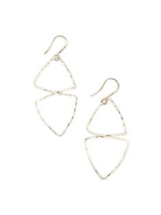 The Good Fortune Textured Earrings by Fair Anita offer a fresh take on traditional large silver hoops. Featuring a bold geometric design with a hammered texture, these silver dangle earrings bring just the right touch of sparkle and elegance to your look. Perfect for dressing up or adding a unique flair to your everyday style, they’re a must-have for any jewelry collection. Sustainable Materials Alpaca silver earrings. Please note that the pendants themselves have nickel in them, but the ear wir Silver Hammered Drop Earrings, Nickel Free Triangle Sterling Silver Earrings, Nickel-free Triangle Sterling Silver Earrings, Everyday Silver Triangle Earrings, Silver Triangle Jewelry For Everyday, Modern Silver Triangle Earrings, Nickel Free Triangle Metal Earrings, Silver Triangle Jewelry With Ear Wire, Nickel-free Metal Triangle Earrings