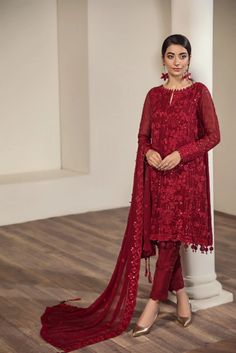 Embroidered Pakistani Salwar Kameez Red Chiffon Salwar Suit is beautifully crafted on a glamorous red shade. This ensemble features classic patterns filled in threadwork of classic patterns in red. Paired with a tonal trouser, the look is complemented by a contrasting-colored pink chiffon dupatta which gives it a charm worth wearing this season. Chiffon Suit Design, Chiffon Salwar Suit, Red Salwar Kameez, Pakistani Salwar, Pakistani Salwar Kameez, Chiffon Collection, Embroidered Chiffon, Red Chiffon, Chiffon Dupatta