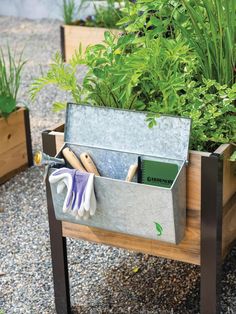 a garden box with gardening tools in it