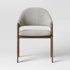 an upholstered chair with a wooden frame and fabric seat, viewed from the front