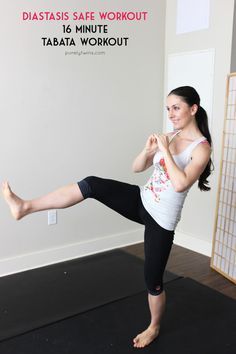 a woman is doing an exercise with her leg up in the air while standing on one leg