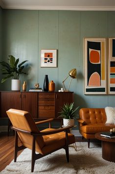 a living room filled with furniture and paintings on the wall next to a coffee table