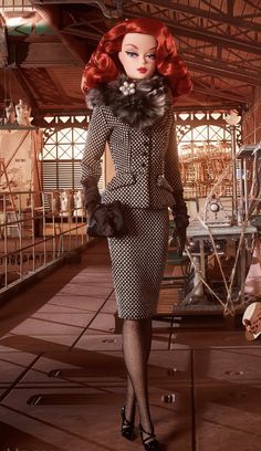 a woman in a dress and hat walking down a hall with other mannequins