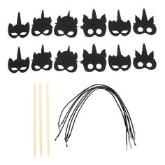 a bunch of black masks and sticks on top of a white background with the words, cat