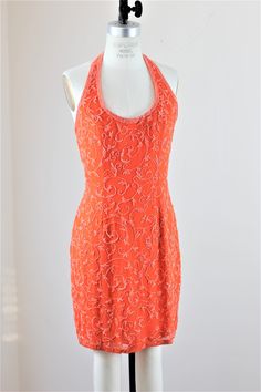 "Party time!! Can you wear orange?? Not all people can..but those who can..should!! This is a beautiful tangerine dress...with a halter top, absolutely darling!! Excellent condition Measuring: 35\" length Bust: 36\" Waist: 28\" Hip: 38\" Pet Free/smoke free Enjoy!" Embellished Fitted Halter Dress For Cocktail, Embellished Fitted Halter Dress For Evening, Embellished Halter Neck Evening Dress For Summer, Orange Backless Party Dress, Elegant Orange Sequin Dress, Orange Halter Neck Dress For Cocktail, Summer Embellished Halter Neck Dress, Sleeveless Beaded Straps Summer Evening Dress, Embellished Halter Neck Dress For Summer