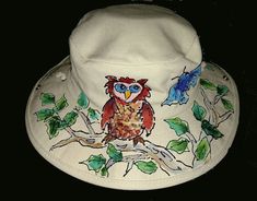 This is a great hat for the outdoors! Whether you're into gardening, fishing, or walking on the beach, this hat will shield you from that summer sun. Adjustable chin cord will keep it from blowing away on a windy day. 100% heavy cotton canvas, natural color; individually hand painted with an Owl perched on a tree branch, and a hawk on the other side. Hawk is inspired by the red-shouldered hawks that nest in my neighborhood! Each hat is painted freehand, so no two look exactly alike. The acrylic paints used are permanent, so if your hat happens to land in the water, not to worry. The hat might be all wet, but the painted design will still be there. One size, fits L-XL. Hand wash. Walking On The Beach, Outback Hat, Hat For Men, Windy Day, Hat For Man, Tree Branch, Acrylic Paints, Summer Sun, Natural Color