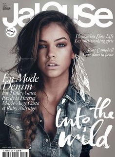 a magazine cover with a woman in denim jacket