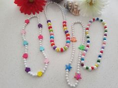 These are handmade necklace with pearls and colourful beads.I made with stretch thread so perfectly fit will be any neck size. Its perfect gift for children. White Beaded Necklaces With Round Beads For Birthday, White Beaded Necklaces For Birthday, White Necklaces With Colorful Beads For Birthday, White Beaded Necklace For Birthday, Playful White Beaded Necklaces For Birthday, Playful White Beaded Necklace For Birthday, Playful White Beaded Necklaces With Round Beads, Handmade White Beaded Necklaces For Birthday, Handmade White Beaded Necklace For Birthday