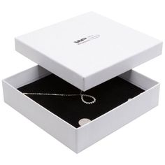 an open white box with a silver chain in the middle and a single diamond on the bottom