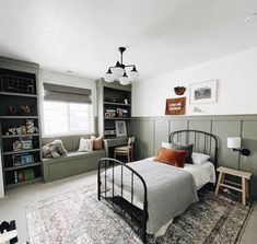 a bedroom with a bed, bookshelf and rug