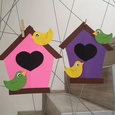 two bird houses with hearts and birds on them