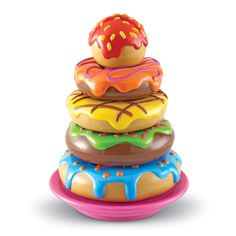 a stack of donuts sitting on top of each other in front of a white background