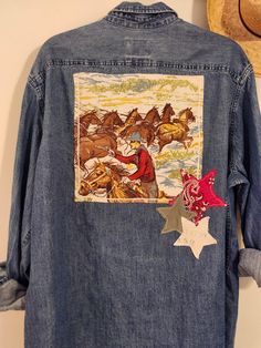 a jean jacket with horses and stars on it