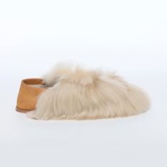 Arguably the most appetizing of the Express series is the Almond Satin. Consume without moderation. ETHICAL ALPACA FUR• Suri Description Slip with ease into the world's softest slippers. Baboosha Alpaca fur slippers deliver the perfect blend of style, elegance, and glamour of high fashion. Our luxury slippers are made for comfort both inside and outside the home. We use a thick vegetan leather sole and the finest Alpaca fur in the world, sourced ethically and cruelty-free. Baboosha are designed Cozy Chalet, Luxury Slippers, Brown Mules, Paris Luxury, Suri Alpaca, Soft Slippers, Fashion Slippers, Designer Slippers, Fur Slippers