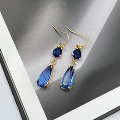 Dainty Sapphire Blue Earrings, Royal Blue Teardrop Earrings, Statement Blue Drop Earrings, Blue Dangle Earrings, Sapphire Blue Drop Earrings. These are simple and beautiful blue teardrop crystal earrings. Blue crystals are framed in bright gold and dangling from gold plated French wire. Measurements: The total length from the top of the hook to bottom - 1.57 inches (40 mm) approximately. Teardrop crystal: 16 mm x 7 mm The earrings would be a PERFECT GIFT for you and your family and friends! Clic Blue Drop Earrings Hypoallergenic, Vintage Blue Drop Earrings Jewelry, Blue Drop Earrings, Gold Plated, Nature-inspired Blue Dangle Earrings, Vintage Blue Dangle Earrings, Sapphire Blue Earrings, Blue Drop Earrings, Blue Dangle Earrings, Bright Gold