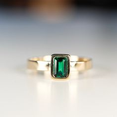 May Birthstone Gemstone Signet Ring For Anniversary, Emerald Bezel Set Signet Ring For Promise, Stamped 14k Jewelry For Promise Ring And May Birthstone, Heirloom Emerald Ring With Round Band, Emerald Jewelry With Accent Stones In Round Band, Emerald Gemstone Ring With Round Band, 14k Gold Emerald Cut Rings For May Birthstone, Emerald Signet Ring For Anniversary, Emerald Round Band With Accent Stones