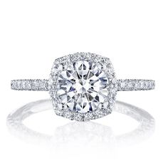 a cushion cut diamond ring with pave set shoulders