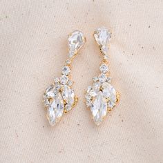 The smaller version of NAZ earrings, our IDIL drop earring! Inspired by tear drop shaped crystal that trickles down the ear to add a lasting touch to every look. These will look elegant with a casual look or a night out paired with your favorite dress and heels. They are meant to become your earrings of choice for high-style event. Handcrafted Highest Quality Swarovski / Cubic Zirconia Platinum plated Guards against scratches and tarnish. approximate size 1.15" length 0.15" width Nickel free Fre Swarovski Drop Earrings, Earring Inspired, Crystals Earrings, Boutique Couture, Swarovski Crystal Earrings, Earrings Wedding, Drop Earring, Wedding Jewelry Sets, Gold Drop Earrings