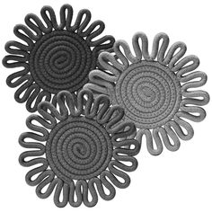 three circular rugs are shown on a white background, one is grey and the other is black