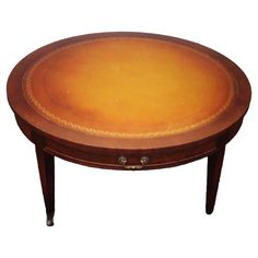 a wooden table with an oval shaped top