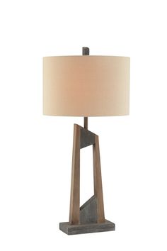 a table lamp with a wooden base and a light shade on it's side