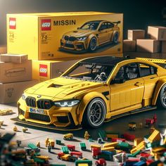 a lego model of a yellow sports car in front of some boxes and other toys