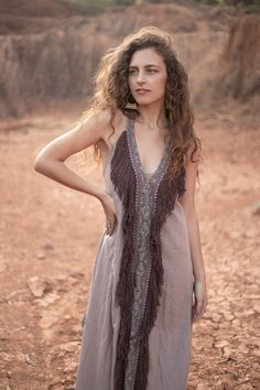 The Bedouin Dress is made of hand loomed raw silk and features an open back with adjustable straps that enable you to find your preferred neckline depth and a drawstring at the seam line of the open back to raise it lower backline. Size | One Size AUS 6 - 12 UK 6 - 12 US 2 - 8 EU 34 - 40 See last pic for size chart Fabric | Hand loomed raw silk Featuring raw silk fringing Featuring hand block printed trim detail Care | Dry clean only Or Hang in soft sunlight or breeze to freshen. Hippie Maxi Dress With Tassels For Summer, Bohemian Sleeveless Maxi Dress With Back Tassel Tie-up, Long Bohemian Dress With Back Tassel Tie-up, Maxi Length Beach Cover-up Dress With Tassels, Maxi Length Tassel Dress For Beach Cover-up, Maxi Length Beachwear Dress With Fringe, V-neck Boho Dress With Tassels For Festival, Sleeveless Fringe Maxi Dress For Beach Cover-up, Sleeveless Fringe Maxi Dress For Beach