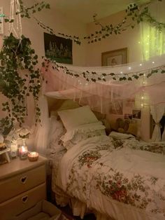 a bedroom with a bed, dresser and hanging plants