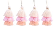 four tasselled ornaments hanging from strings