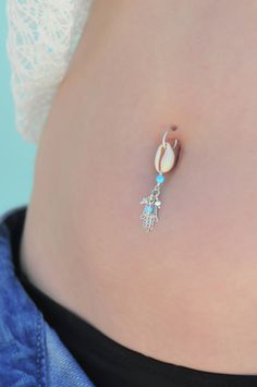 "A feminine and delicate Hamsa belly button ring made with dangling Swarovski crystal beads. This navel piercing is handmade of a 14k gold filled or Silver hoop, Hamsa hand pendant, Cowrie shell pendant, and blue Opal stones. The Hamsa (or Hand of Fatima) is a middle-eastern symbol of good luck, said to keep evil spirits away. Wear it or give it to a loved one to use as an amulet to give protection and good luck. Do not hesitate to contact me for special requests and customization! ♥♥ In a hurry Dangle Body Jewelry With Charms As Gift, Silver Dangle Belly Rings Nickel Free, Dangle Belly Ring As Gift, Nickel-free Silver Dangle Belly Rings, Dainty Dangle Belly Rings As Gift, Nickel Free Sterling Silver Dangle Belly Rings, Nickel-free Dangle Belly Rings In Sterling Silver, Dainty Dangle Body Jewelry, Nickel-free Sterling Silver Dangle Belly Rings