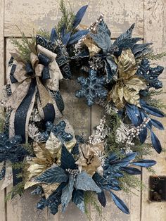 a blue and gold wreath on a door