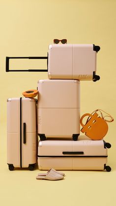 several pieces of luggage stacked on top of each other with one bag and the other handbag