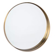 a round mirror on a white wall