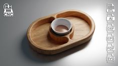 a wooden tray with a cup and saucer on it that is shaped like a boat