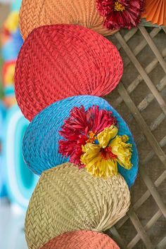 several colorful baskets with flowers on them