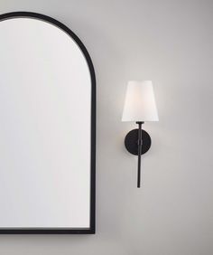 Light up your life with this traditionally styled convertible wall sconce. This fixture is finished in a sleek black finish with a white fabric shade This handy sconce can be hard wired, or used with included wall plug for any area in your home. allen + roth Spackman 5.98-in W 1-Light Matte Black Transitional Wall Sconce | WS63-1MBK Painted Trim, Allen Roth, Painting Trim, Wall Plug, Rolling Hills, Fabric Shades, Decor Lighting, Vanity Lighting, White Fabric