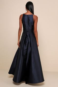 Raise a glass in the Broadway Show Navy Blue High-Low Maxi Dress! Medium-weight woven taffeta, with a high shine sheen, shapes this showstopping gown with adjustable spaghetti straps, an apron neckline, and a princess-seamed bodice. Fitted, banded waist sits atop a flowy, high-low maxi skirt with box pleats, side seam pockets, and a voluminous silhouette. Hidden back zipper/clasp. Fit: This garment fits true to size. Length: Floor length. Size medium measures 34.5" from top to bottom. Bust: Grea Prom Dress Shops, Voluminous Dress, High Low Maxi Skirt, Dress Box, Broadway Show, Dress Shops, High Low Gown, High Low Maxi Dress, Fall Wedding Guest Dress