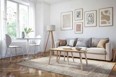 a living room filled with furniture and pictures on the wall above it's coffee table