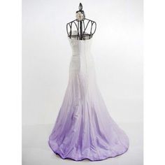 a dress on a mannequin with purple and white ombrella in the skirt