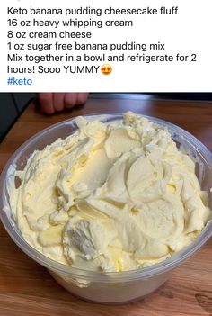 a plastic bowl filled with whipped cream on top of a wooden table