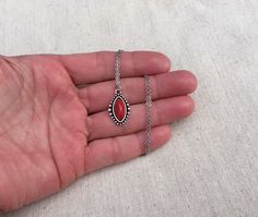 "Simple, chic and versatile! Here is a red stone necklace that is set in a perfectly detailed silver frame. The perfect everyday necklace! Made from allergy free plated silver. The pendant measures 1\" long by 1/2\" wide. It hangs from a shiny strong 18\" stainless steel necklace chain with a lobster clasp. I have matching earrings in my shop if you would like the whole set. Here is the link https://etsy.me/2R5NsWx I have this same style pendant necklace available in other color ways as well! He Red Southwestern Sterling Silver Necklace, Red Bohemian Sterling Silver Necklace, Red Southwestern Style Jewelry Gift, Southwestern Style Red Jewelry For Gift, Southwestern Style Red Jewelry For Gifts, Southwestern Style Round Pendant Necklace, Nickel-free Southwestern Style Necklace As Gift, Red Southwestern Turquoise Necklace For Gift, Southwestern Style Nickel-free Necklace For Gift