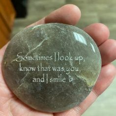 someone is holding a rock with the words sometimes look up, know that was you and smile be