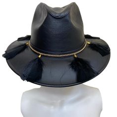 Mexican Handcrafted Leather Fedora Hat | El Cuervo Black A COMPLETE head-turner! Unique/genuine Nubuck Leather ( is top-grain cattle leather that has been sanded or buffed on the grain side, or outside, to give a slight nap of short protein fibers, producing a velvet-like surface) hat on this Men & Women’s Mexican artisan fedora-form in Elegant Black color with genuine leather details around crown, decorative black goose feathers & Gold platted sophisticated accessory ﻿to finish this cus Black Western Fedora High Crown, Black Western Fedora For Western-themed Events, Black Fedora Hat For Western-themed Events, Western-themed Fedora With Feathers, Mexican Sombrero Hat, Western-themed Fedora Hat With Feathers, Fedora Hat Outfits, Modern Hat, Artisan Decor