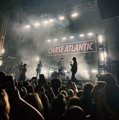 a group of people standing on top of a stage