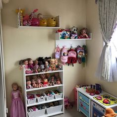 a child's room with toys and dolls on shelves